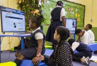 At SOLE NYC, the first School in the Cloud learning lab in the US, students work in groups to answer fun open-ended questions. On Wednesday morning, students sought to answer: why do dogs chase cats? Photo: Dian Lofton/TED